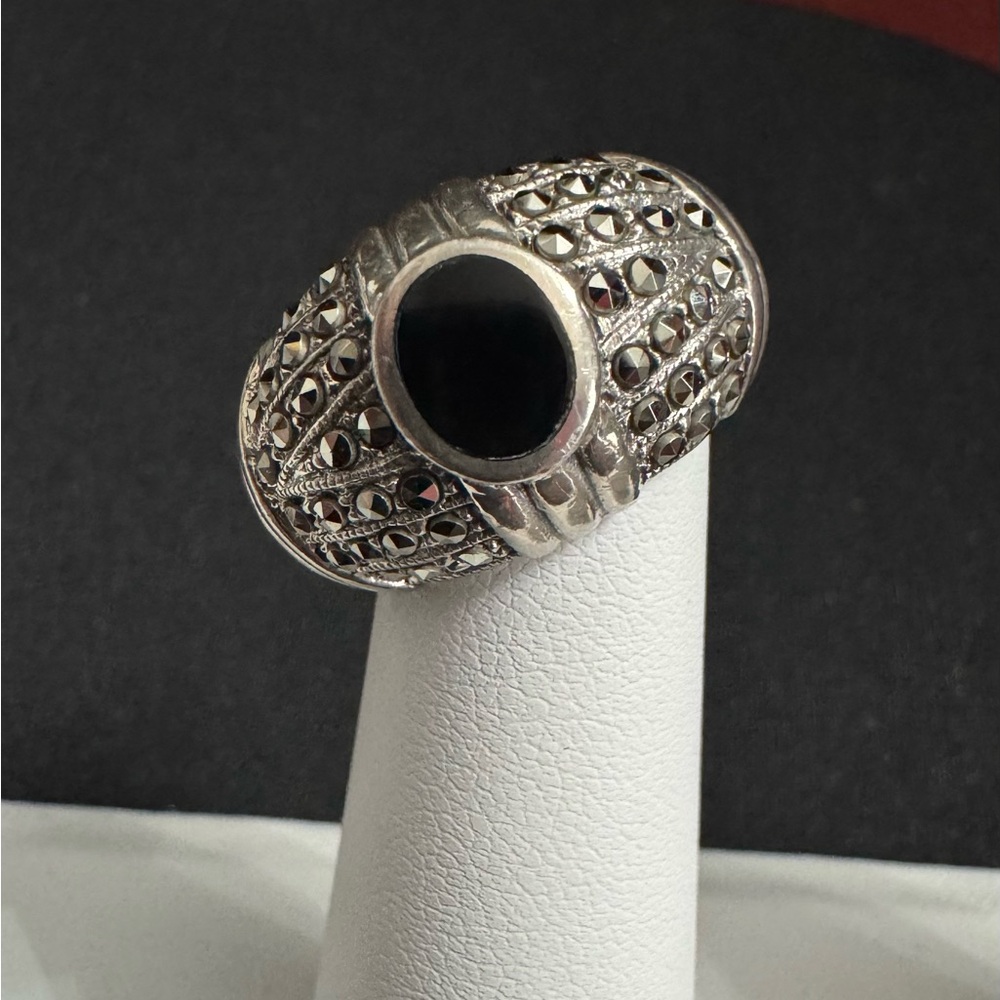 Black Onyx and Marcasite Ring. Dome is surrounded w/vibrant Marcasite stones.
